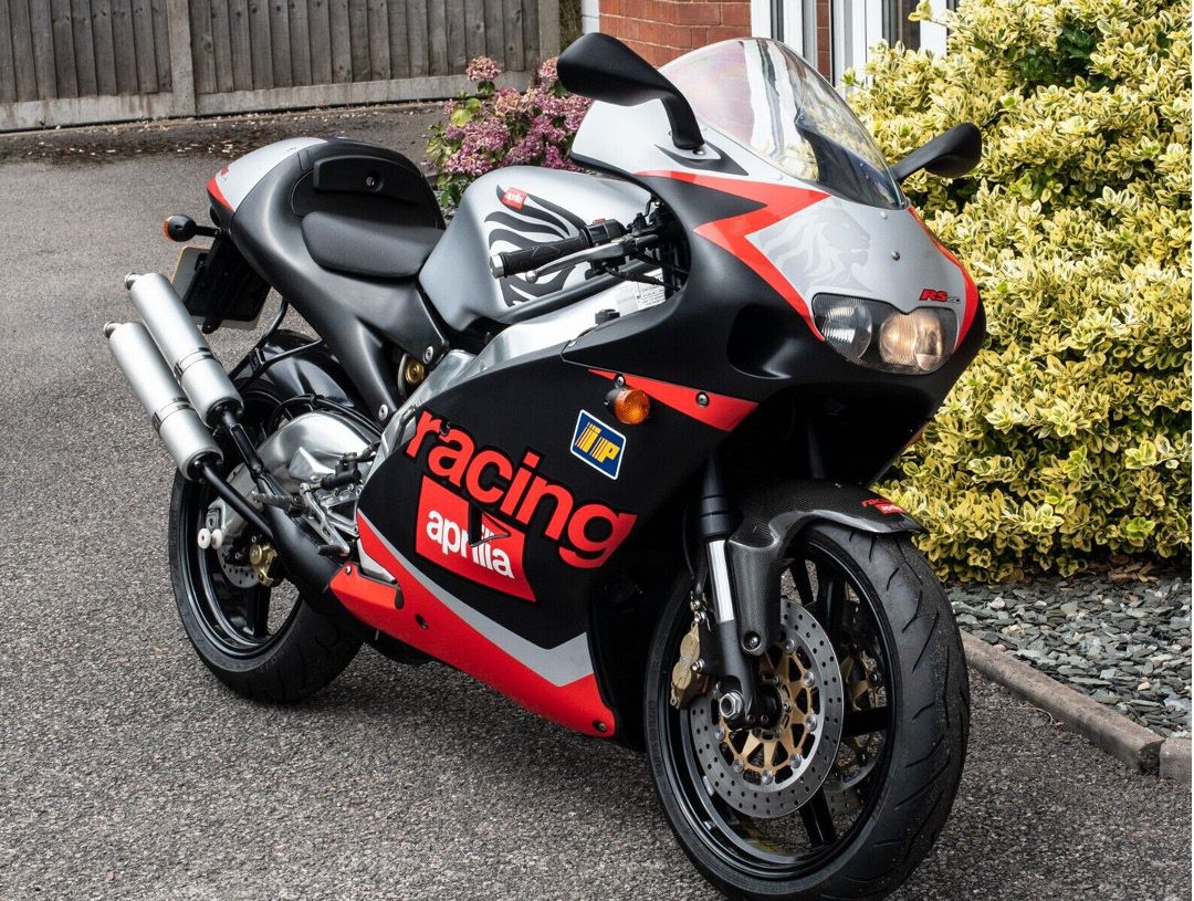 Classic Aprilia RS 2-stroke motorcycle in black and red
