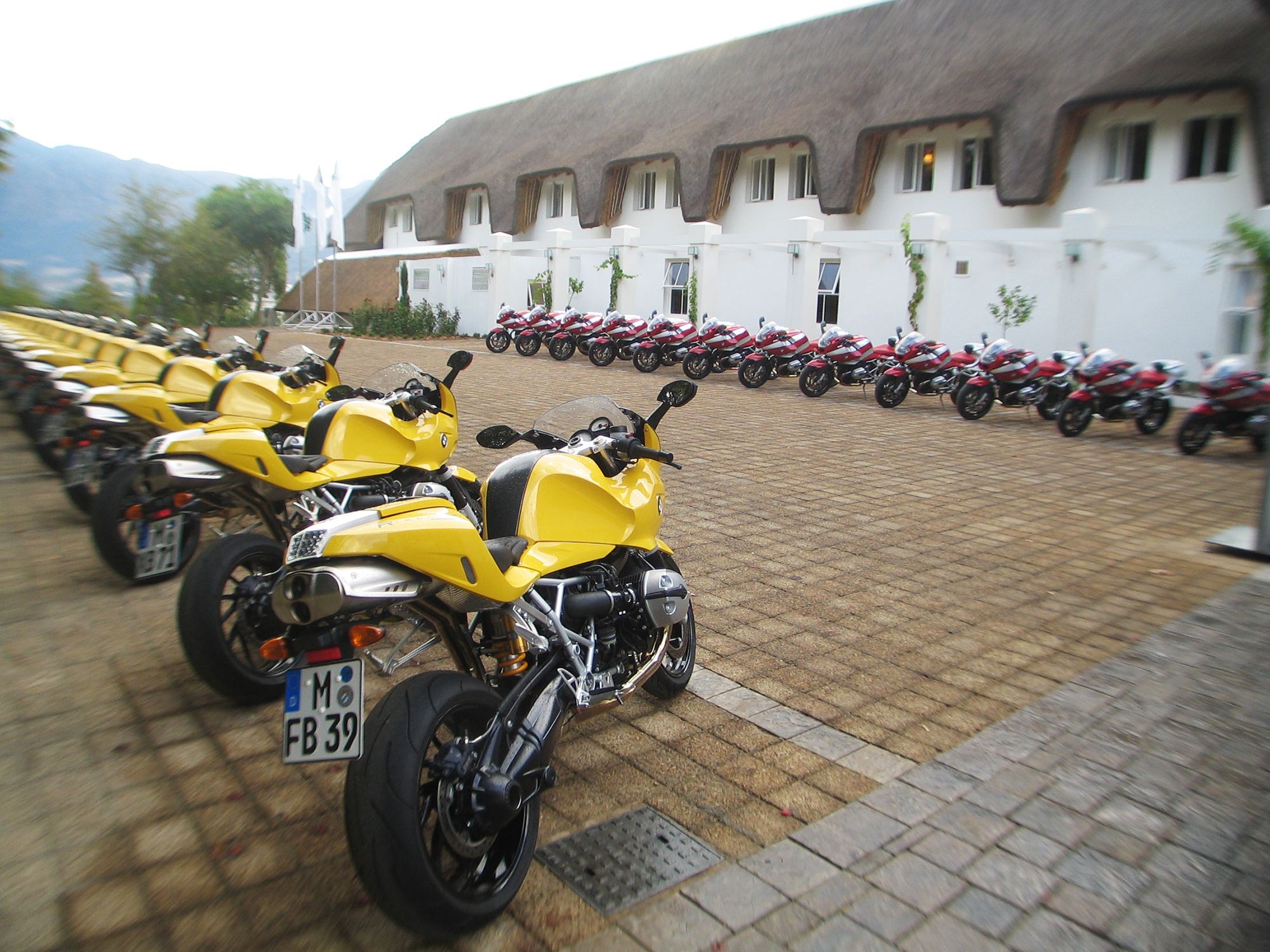 A row of yellow BMW motorbikes at the press launch