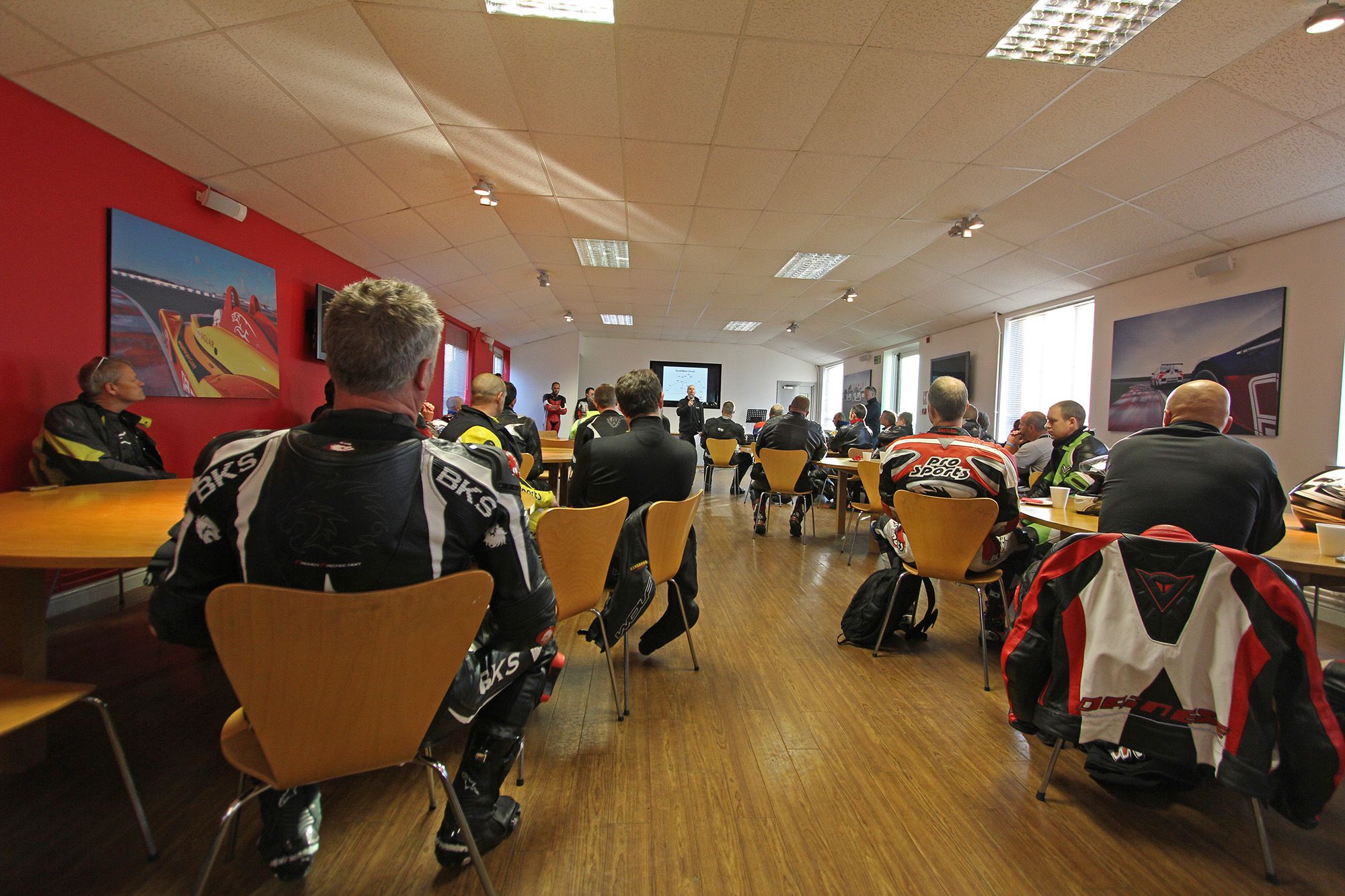Motorbike riders attending a trackday briefing