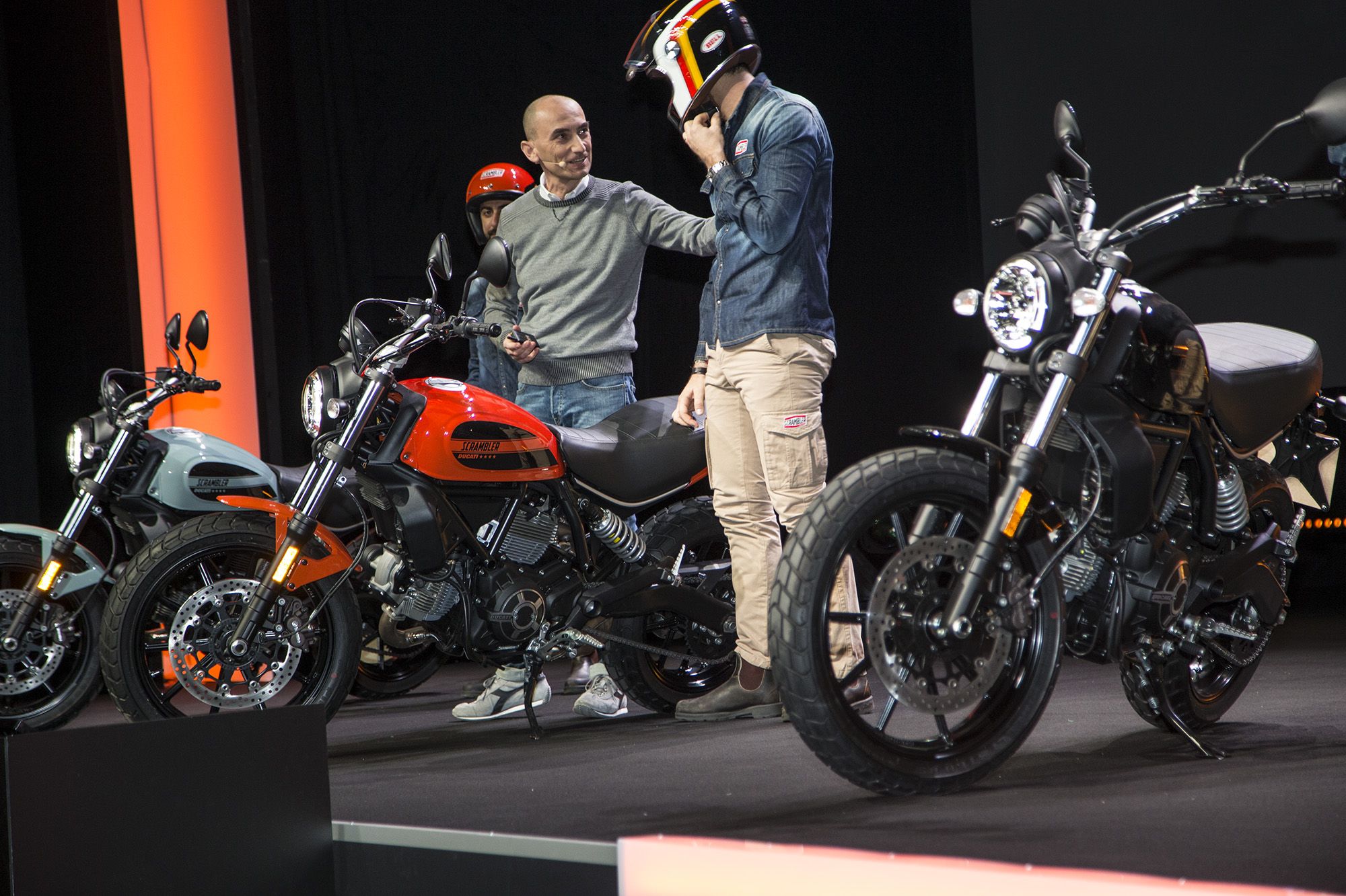 Ducati 400 Scrambler launch with bikes on stage