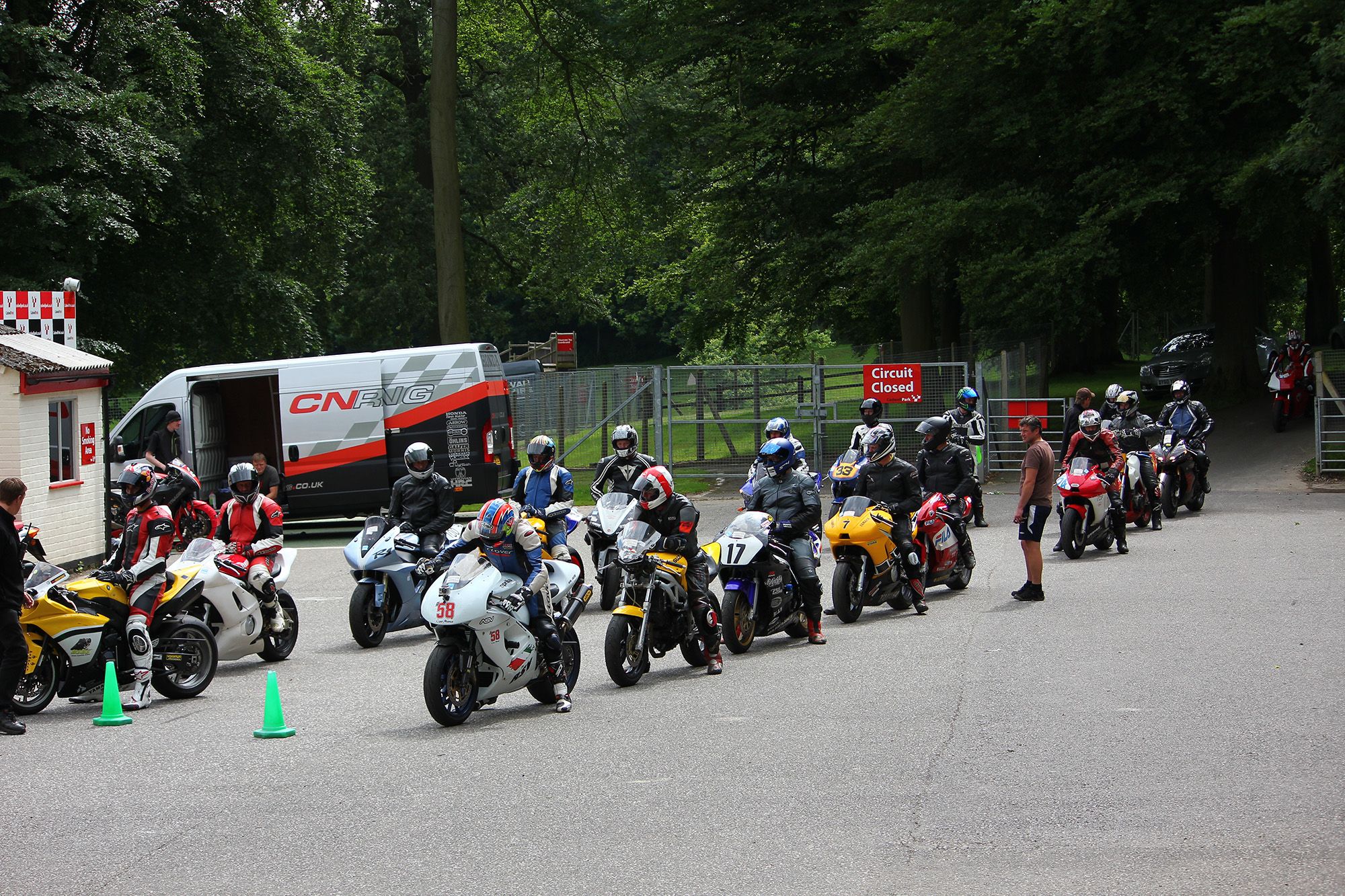 Cadwell Park holding area with motorcycles lined up at Cadwell Park