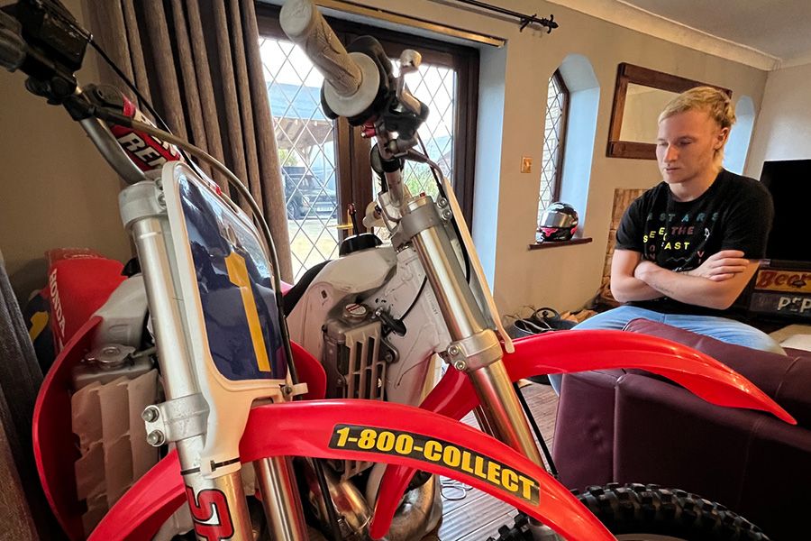 Davey Todd looking at his dirt bike collection