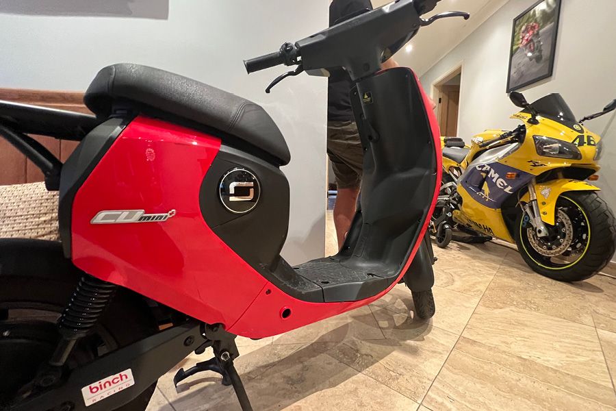 Davey Todd's Super Soco CU Mini and Yamaha YZF-R1 in his hallway