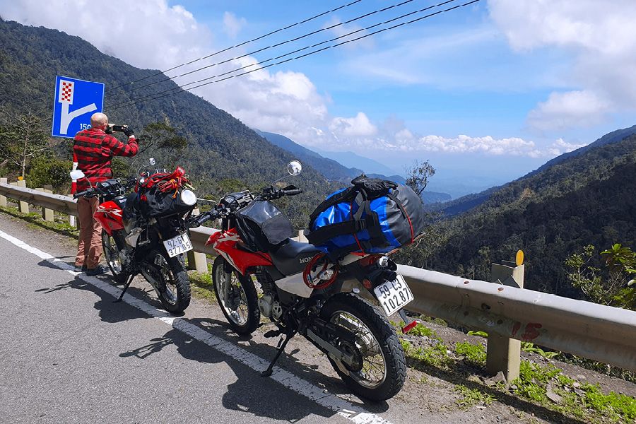 Red Honda Bikes With Backdrop of Vietnamese Mountains