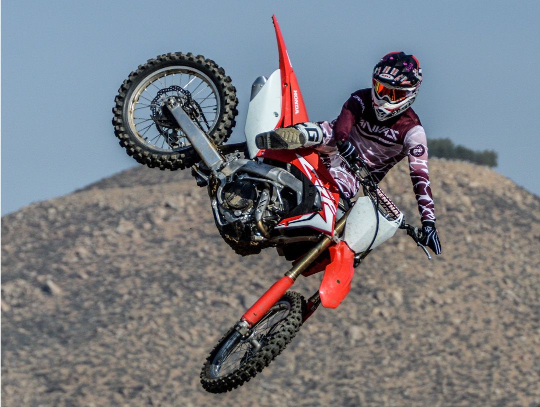 Honda CRF450R jumping in mid air