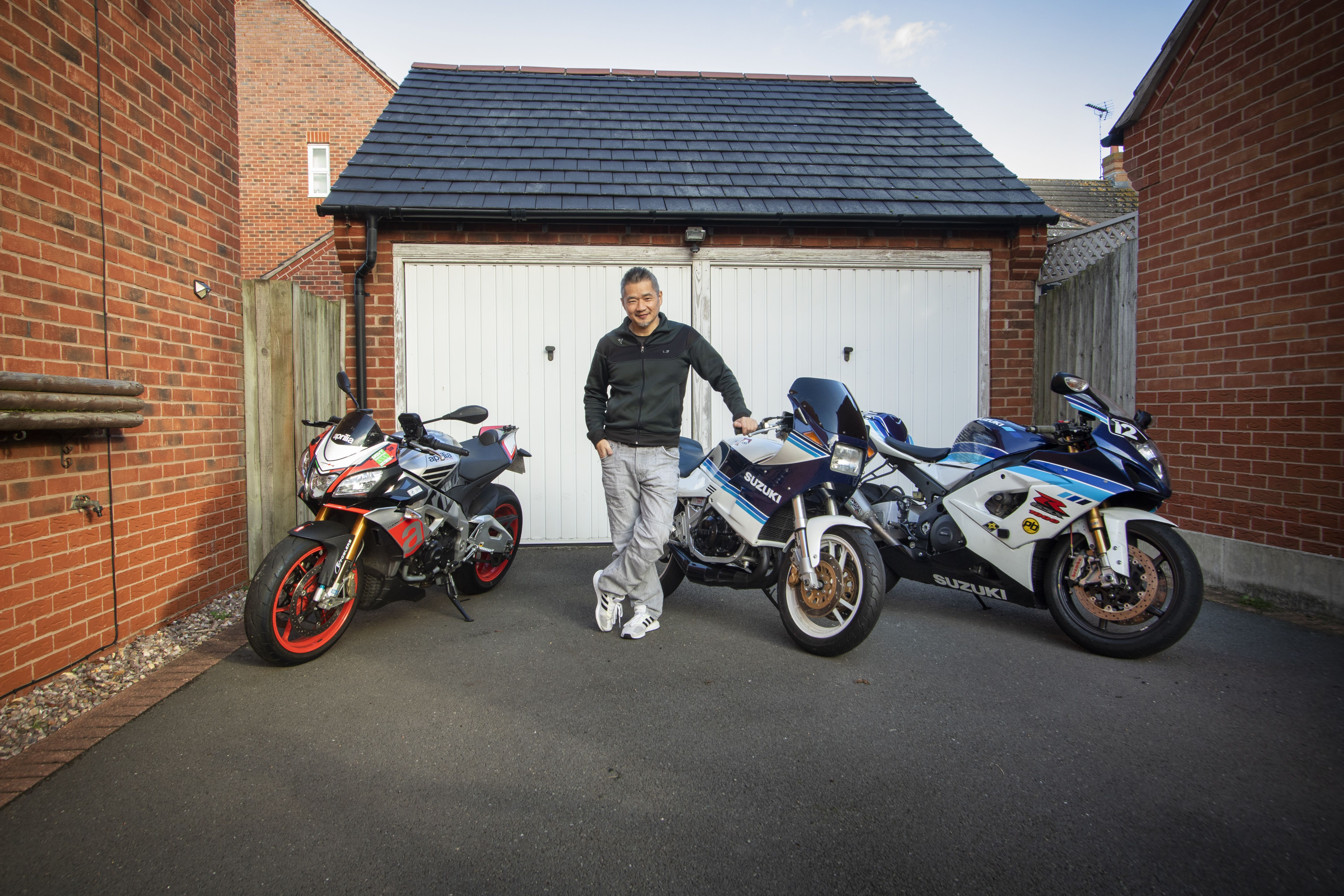 Kar Lee Kardesign with Aprilia Tuono Yamagamma Suzuki GSX-R1000 K6 outside a garage