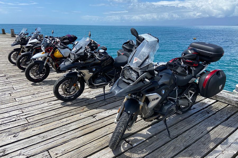Motorcycles parked on Jackson Bay jetty New Zealand