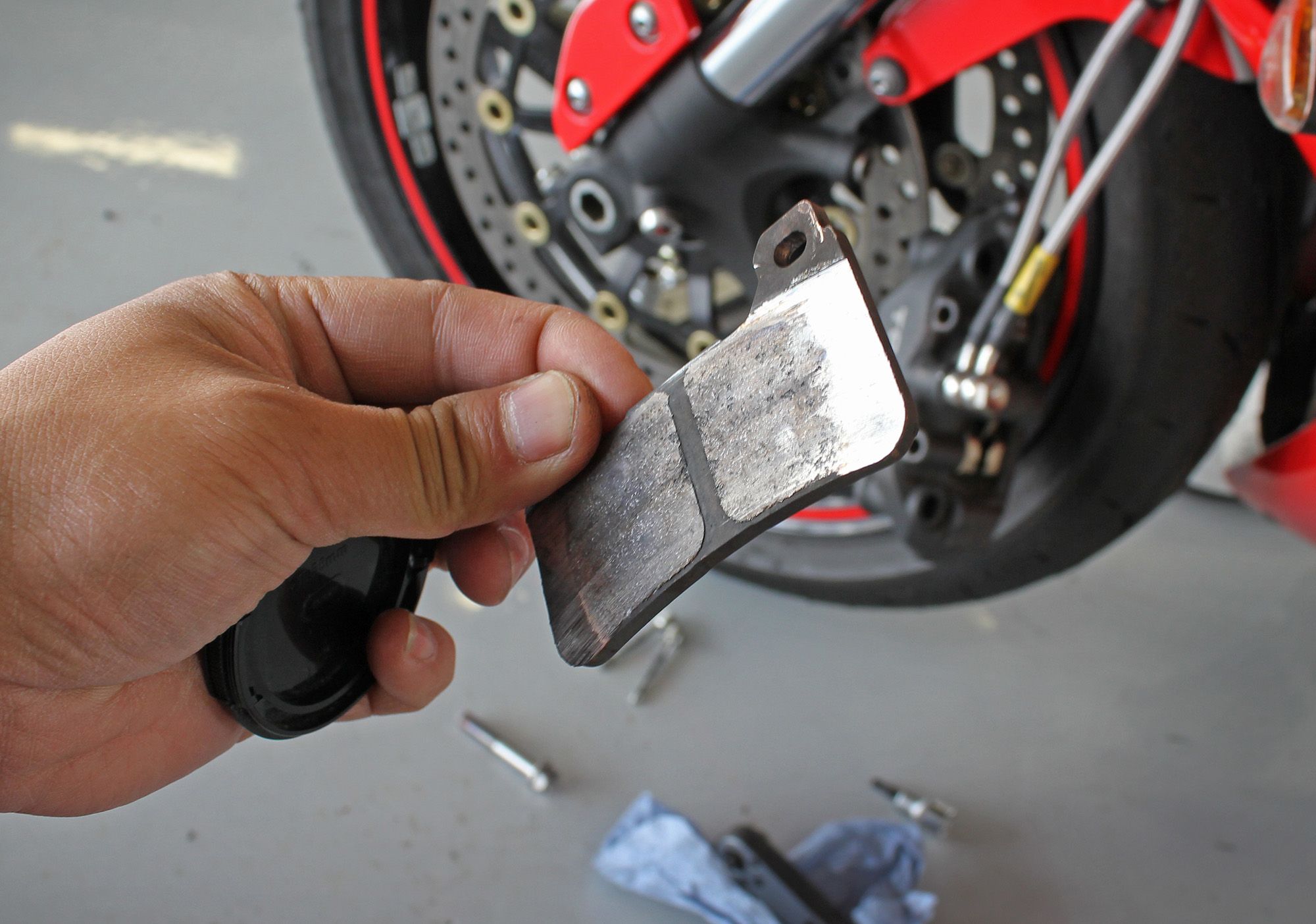 Worn Brake Pads up close after a trackday session