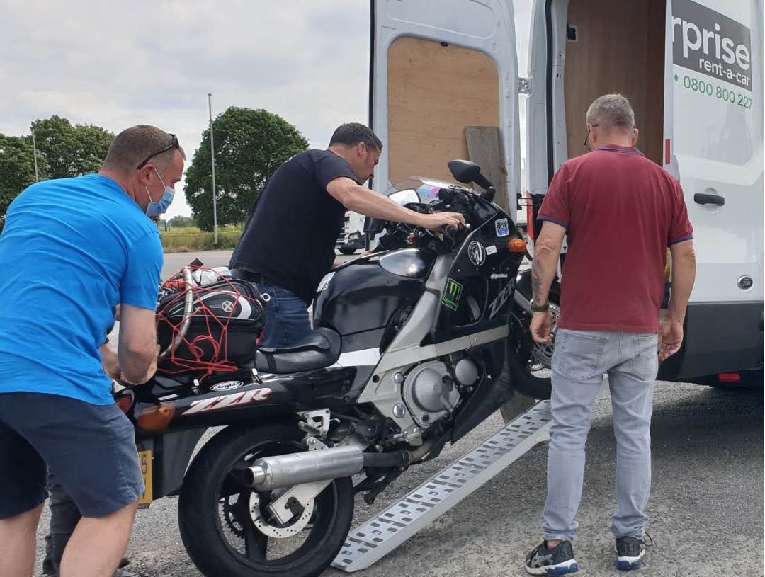The Longest Day Challenge bike being loaded onto a van