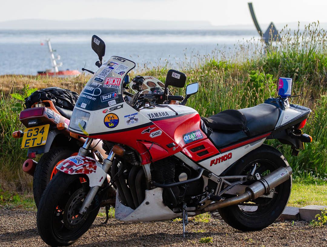 The Longest Day Challenge motorbike parked up covered in stickers