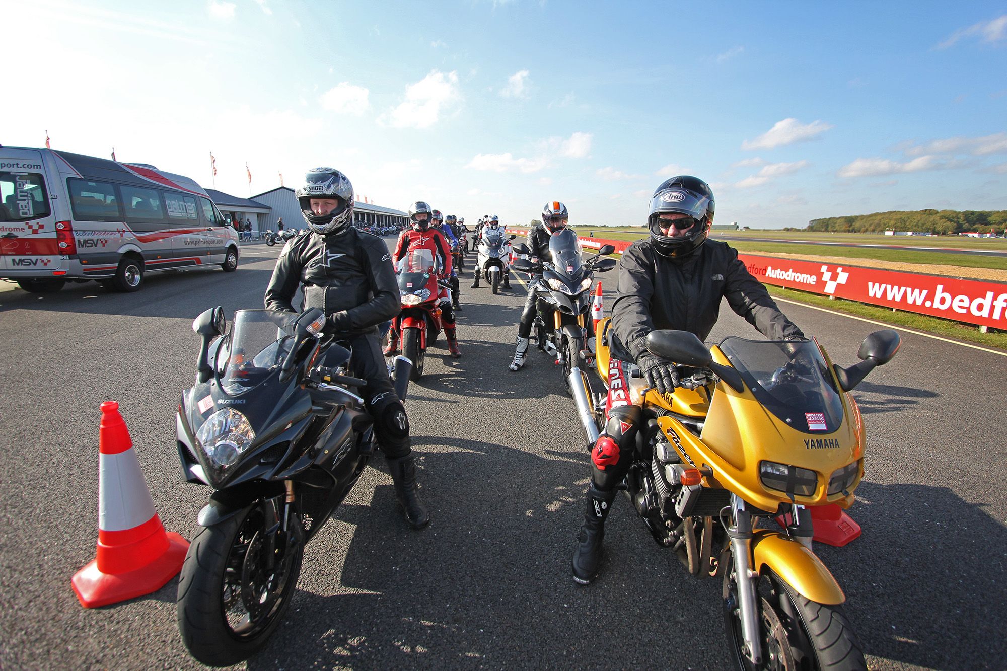 Motorcycles lining up at trackday front view