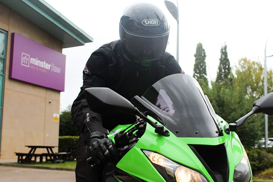 Biker outside Minster Law offices