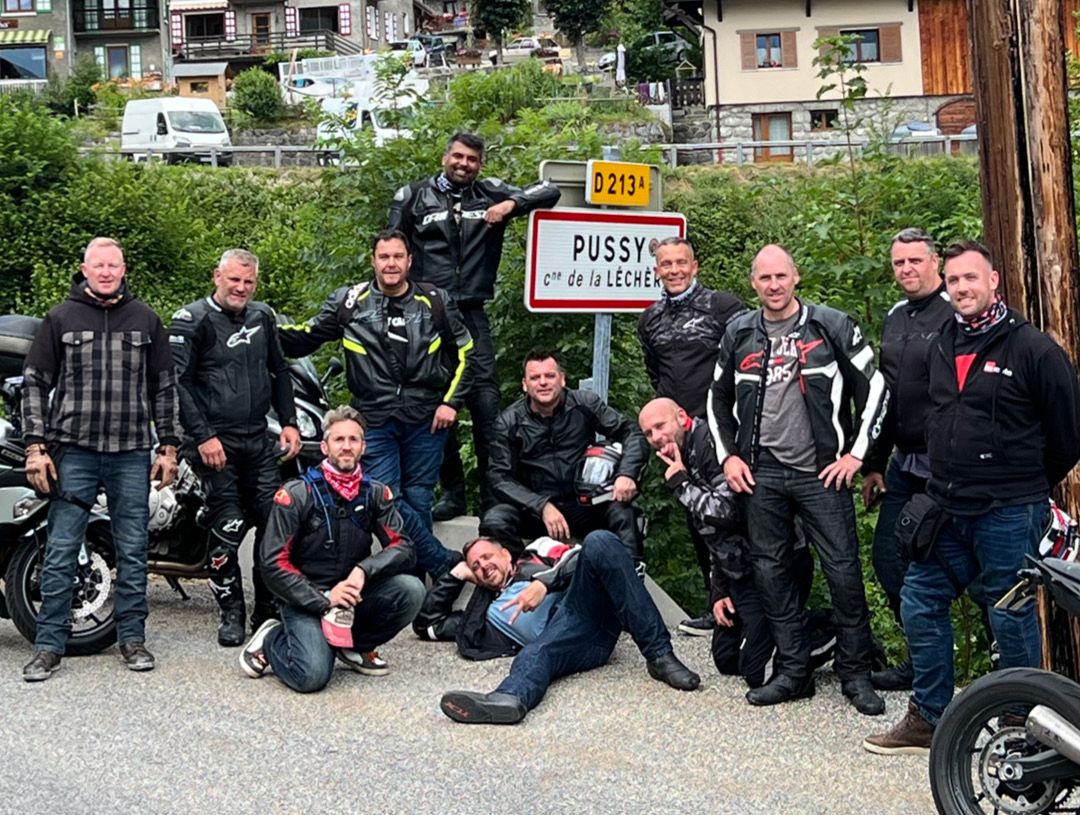 Group of motorcycle riders at the Alps town of Pussy