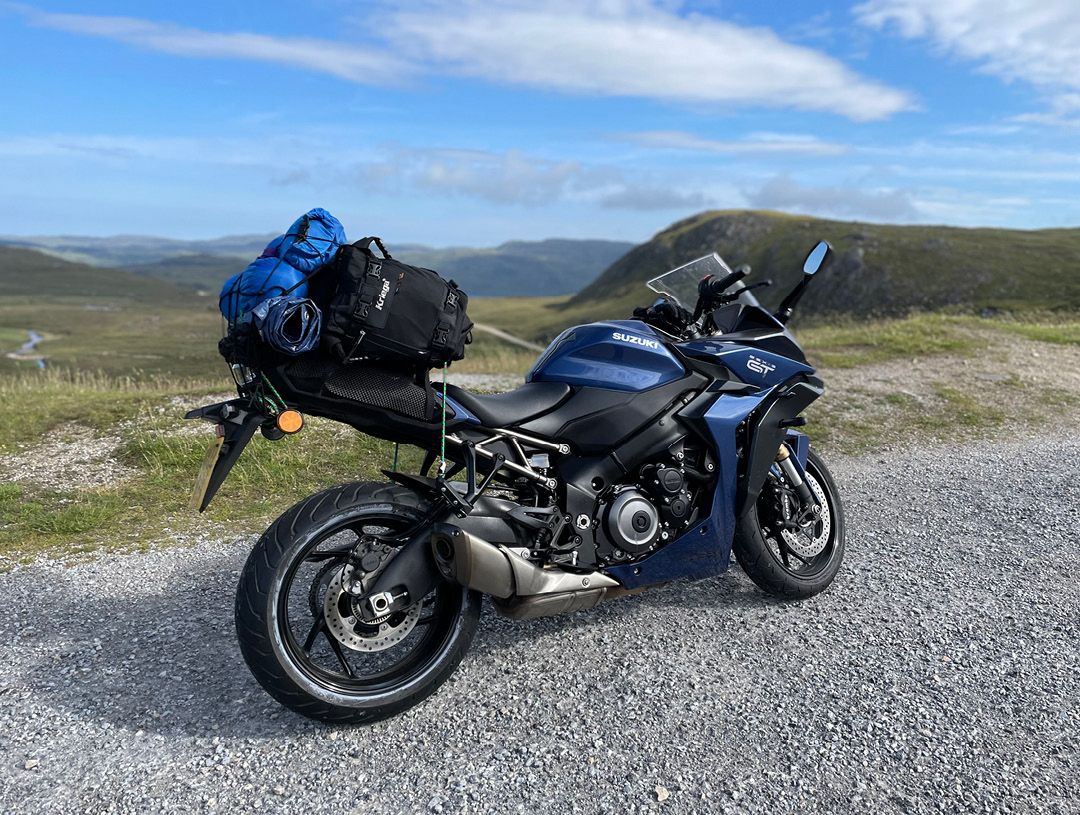 Suzuki GSXS-1000GT with clear skies and hills behind