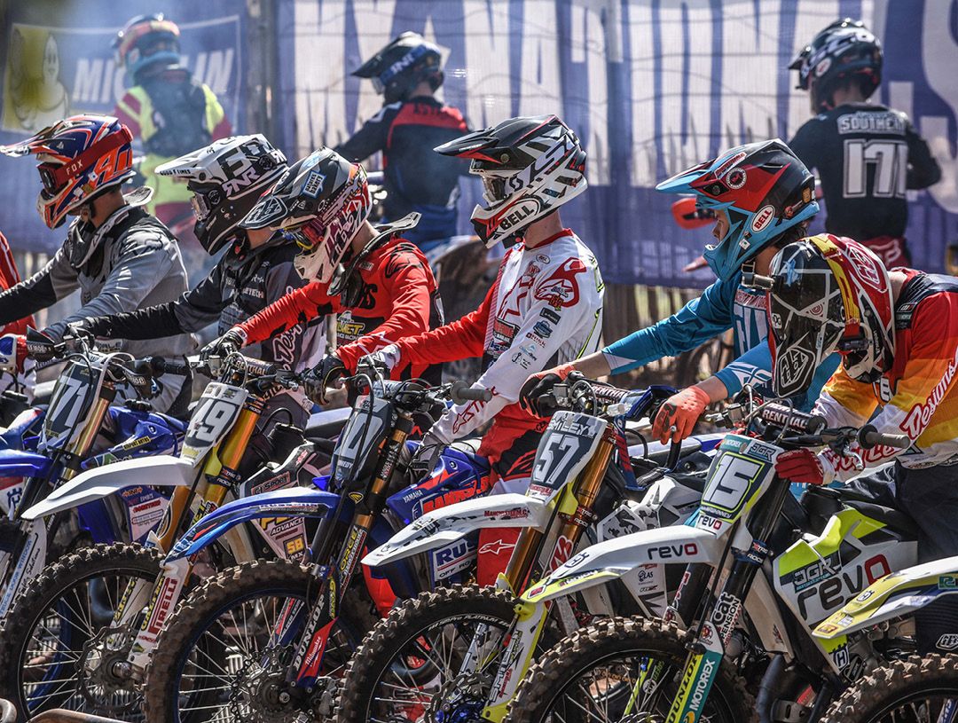 Motocross racers lined up at the start line