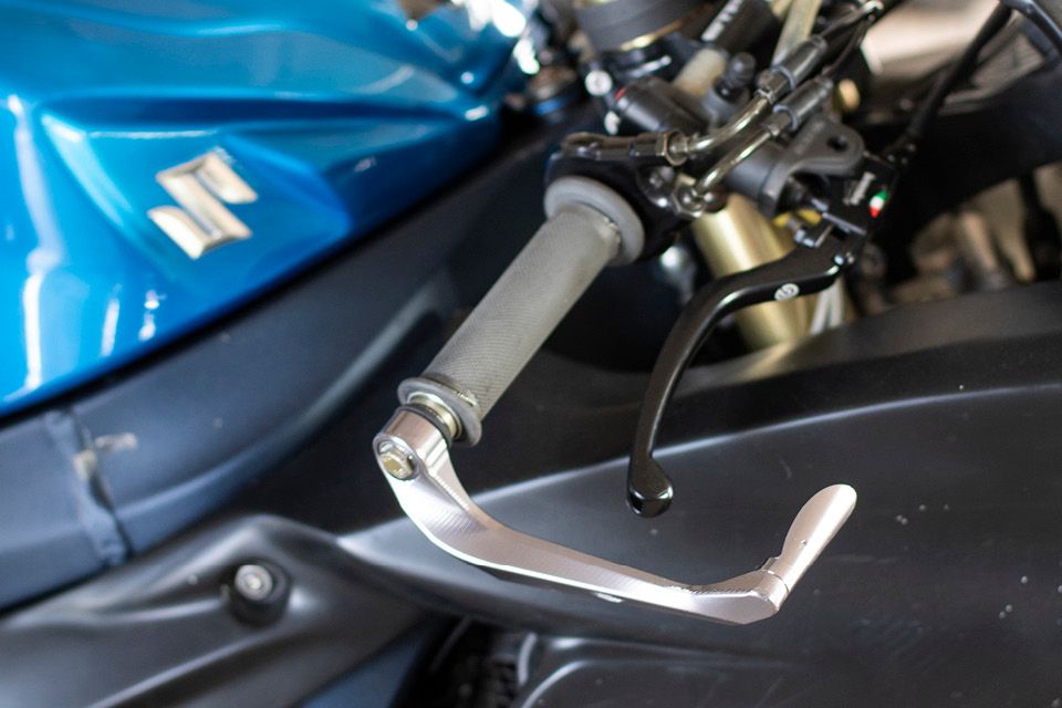 Motorcycle brake lever guard for track