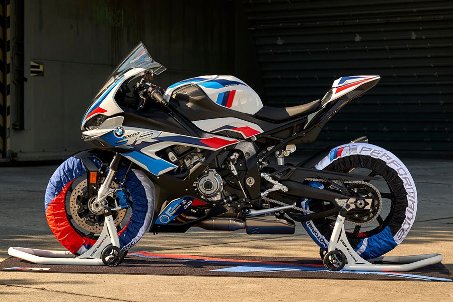 BMW M1000RR with tyre warmers on paddock stands