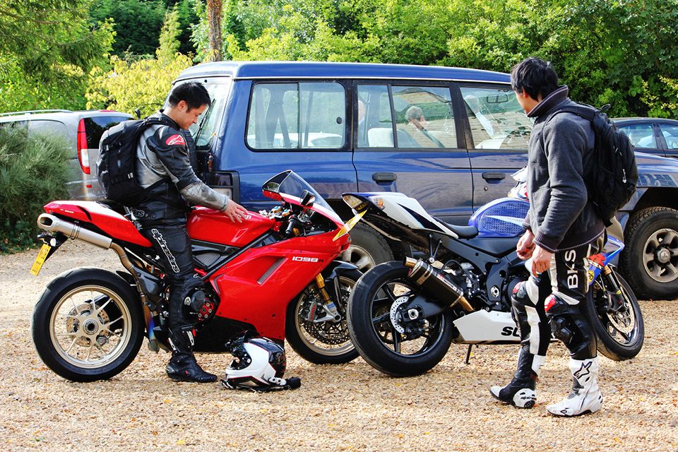 Mates with their motorbikes for recommend a friend