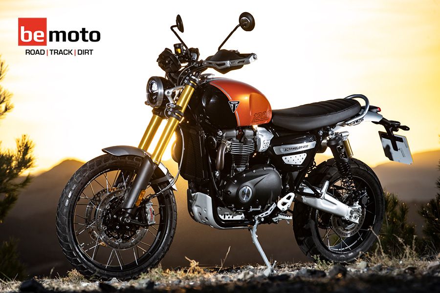 Triumph Scrambler 1200 in Orange set against a sunset