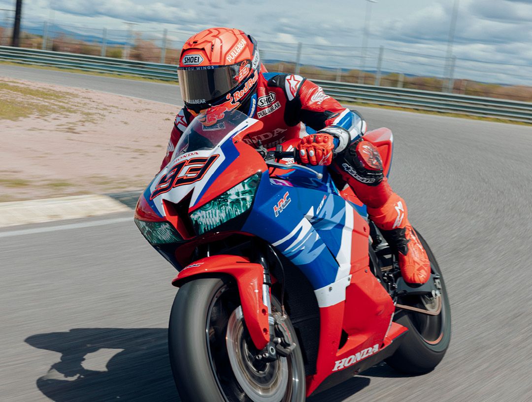 Marc Marquez earing a Shoei X-SPR Pro helmet on track