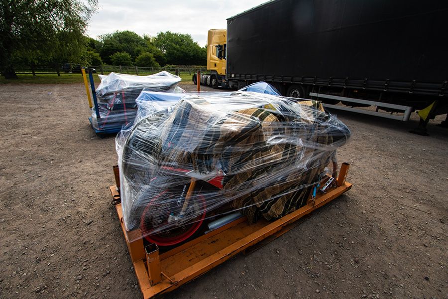 Motorcycle shrink wrapped on stillage for a trackday