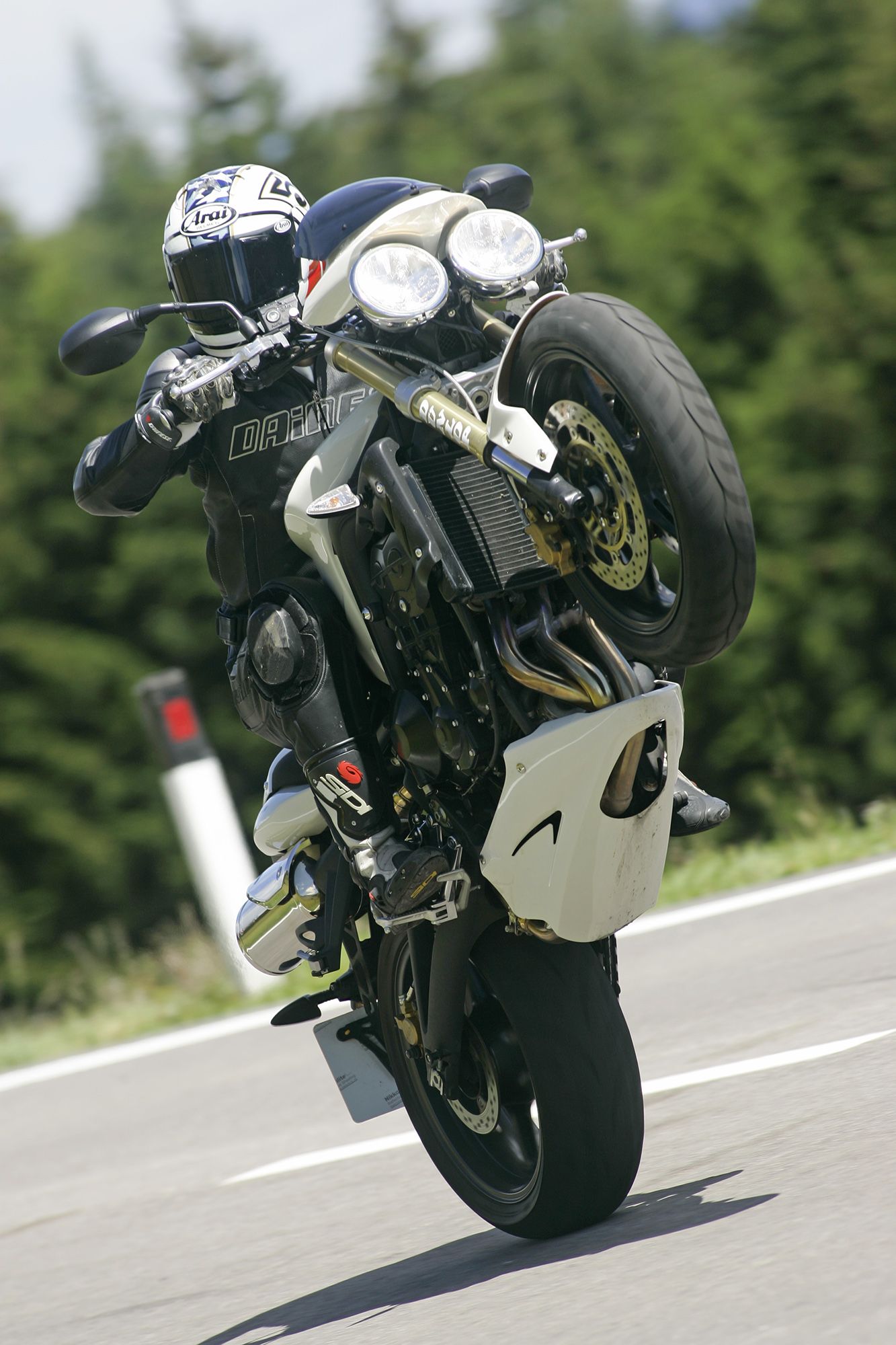 Triumph Street Triple doing a wheelie