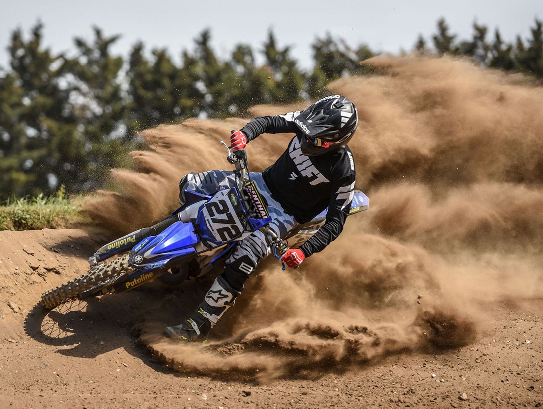  Yamaha YZ250 kicking up dirt on a motocross track