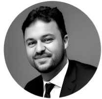 A monochrome headshot photograph of the Head of Customer and Community for BeMoto, Chris Malia.