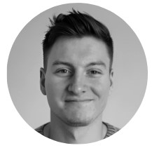 A monochrome headshot photograph of the Head of Business Improvement for BeMoto, Jak Hindley.