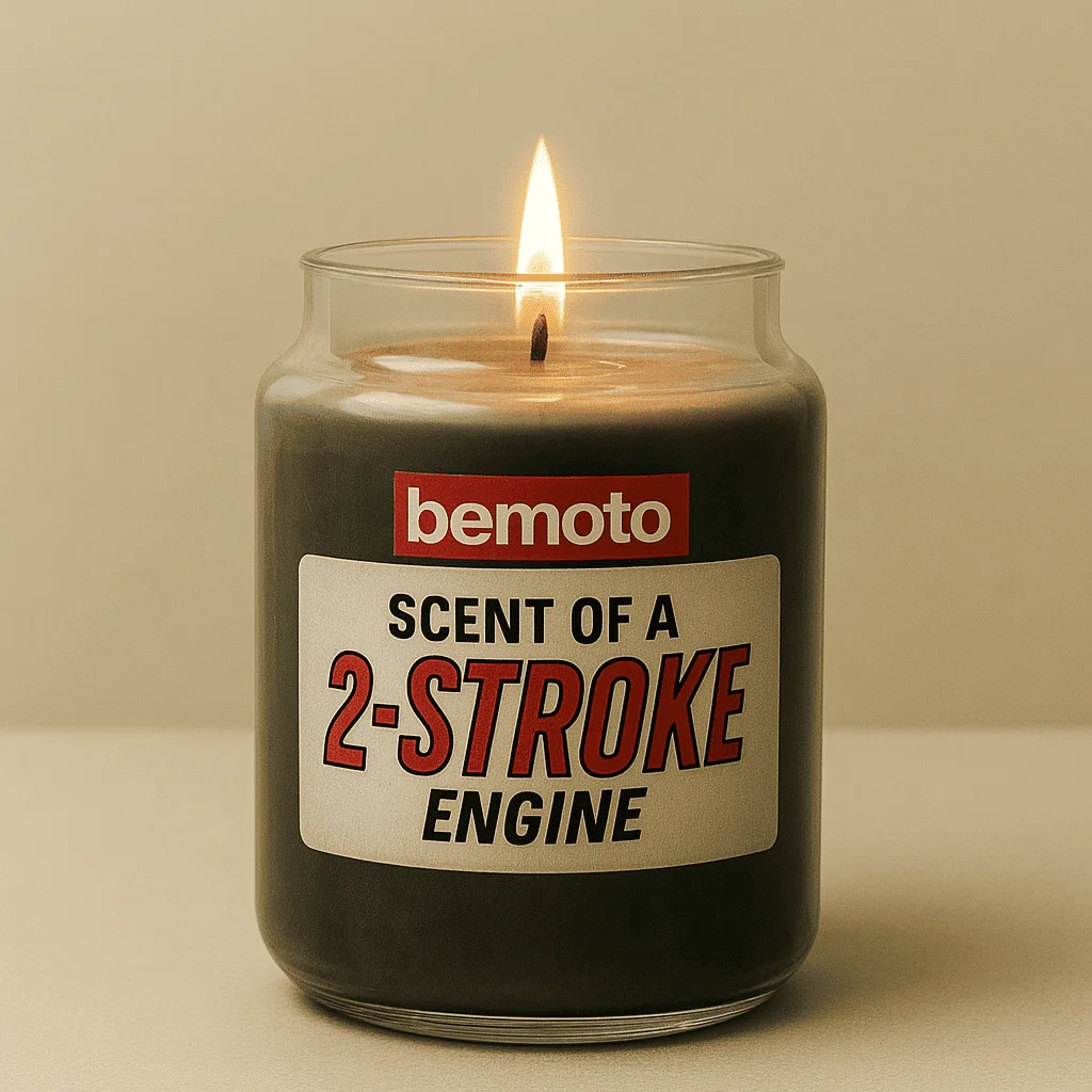 Lit BeMoto candle labelled scent of a two stroke engine, novelty motorbike candle designed to mimic classic engine smells.