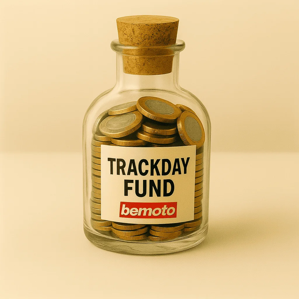 Glass bottle filled with coins labelled trackday fund by BeMoto, novelty savings jar for motorbike track day expenses.
