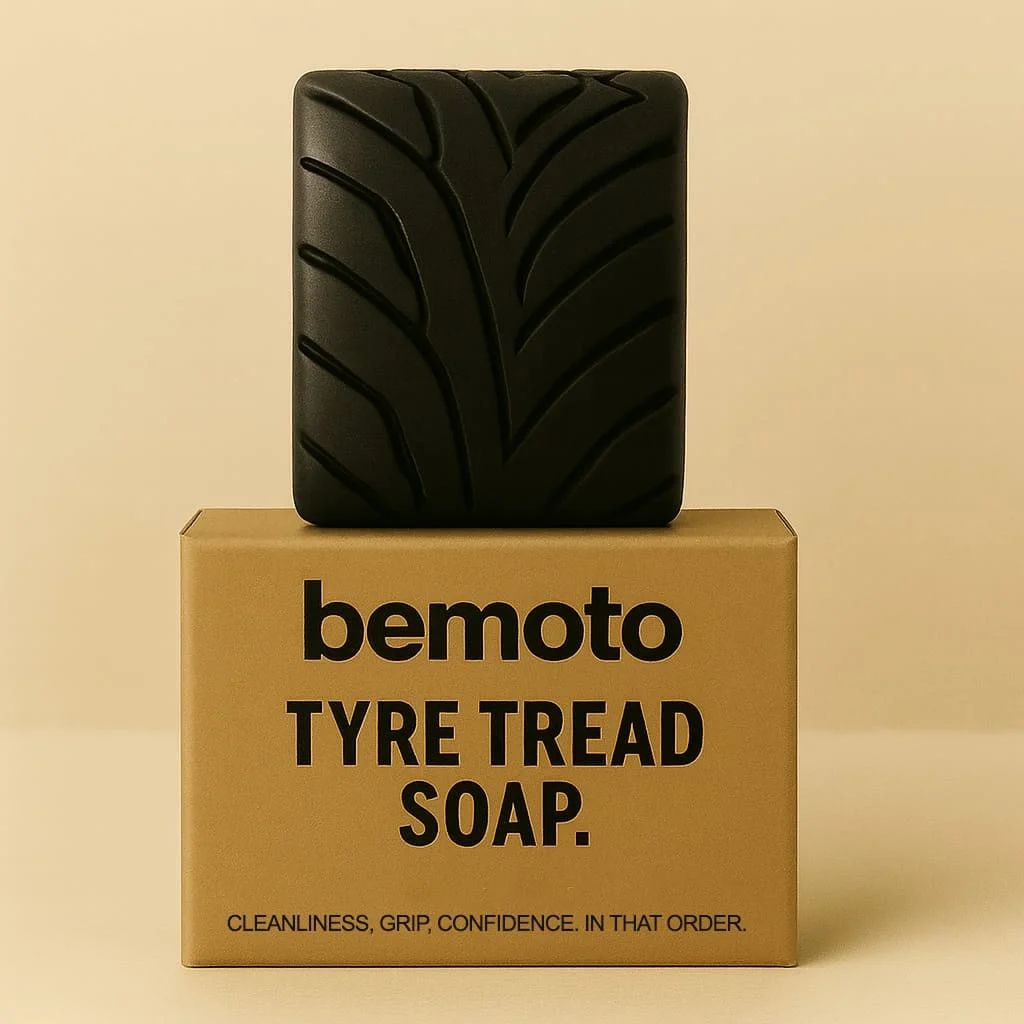 Black tyre tread shaped soap displayed on BeMoto branded box, novelty motorbike themed soap inspired by motorcycle tyres.