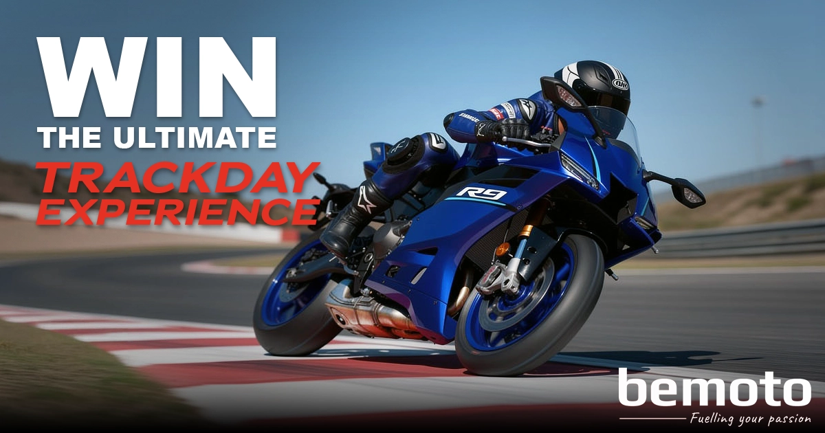 Rider on a blue Yamaha R9 taking a sharp turn on a racetrack. Text says: Win the Ultimate Track Day Experience. BeMoto logo.