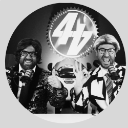 About BeMoto – 44Teeth A black and white promotional photo of the hosts of the 44Teeth YouTube channel in satirical news presenter costumes. Al Fagan is seated on the left and Chris Eades is seated on the right of the image with the 44Teeth logo in central in the background.